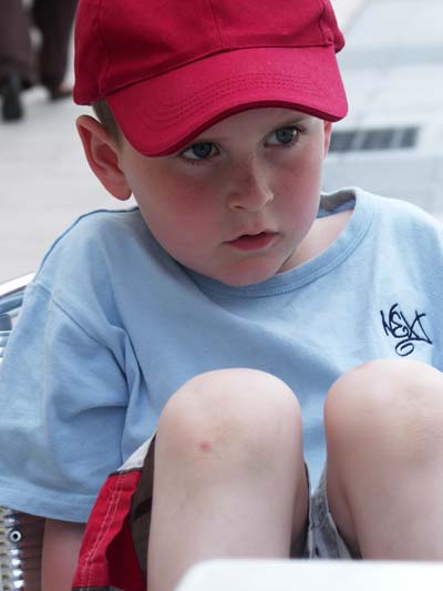 Alex sitting at a cafe in Castres, France