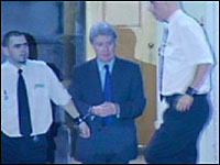 John (Jack) Walker being escorted from the High Court after sentencing.  Image taken from BBC News at  http://news.bbc.co.uk/1/hi/scotland/edinburgh_and_east/6099842.stm