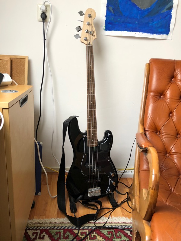 My new bass guitar in my office next to my new comfy chair