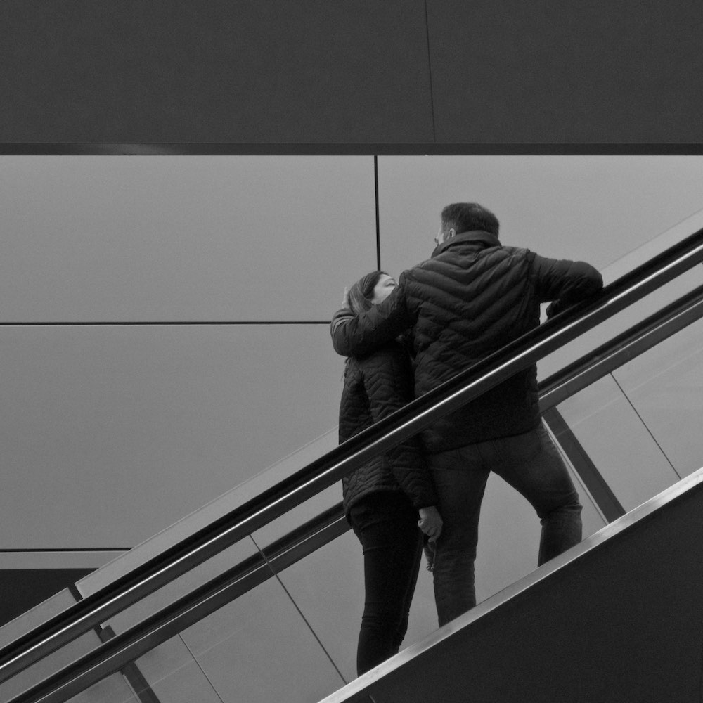 Couple on an escalator