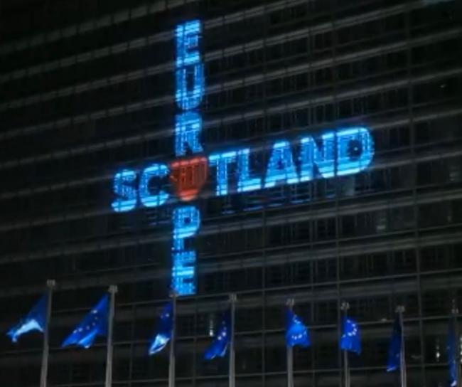 The words Europe and Scotland linked by a heart, projected onto the side of the European Commission HQ